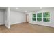 Bright living room with hardwood floors and three large windows at 1346 Wichita Sw Dr, Atlanta, GA 30311