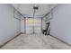 The garage features an automatic door and concrete floors for parking or storage at 2825 Windsor Forrest Ct, Atlanta, GA 30349