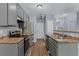 Modern kitchen with stainless steel appliances, grey cabinets, and durable countertops at 2825 Windsor Forrest Ct, Atlanta, GA 30349
