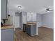 Open kitchen concept flowing to the living room with modern fixtures and luxury vinyl plank flooring at 2825 Windsor Forrest Ct, Atlanta, GA 30349