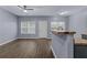 Living room with hard surface flooring, featuring neutral walls and lots of natural light at 2825 Windsor Forrest Ct, Atlanta, GA 30349