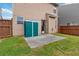 Exterior shot of a backyard with green shed, small patio, grass, and privacy fence at 5885 San Gabriel Ln, Atlanta, GA 30349
