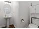 Clean and simple half bathroom with pedestal sink at 5885 San Gabriel Ln, Atlanta, GA 30349
