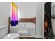 Bathroom showcasing a white toilet, tub with brown tiles, and shower with a colorful curtain at 5885 San Gabriel Ln, Atlanta, GA 30349