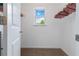 Walk-in closet with built-in hanging racks and a window for natural light at 5885 San Gabriel Ln, Atlanta, GA 30349