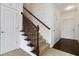 Entryway with stairs, white walls, and dark wood floors at 5885 San Gabriel Ln, Atlanta, GA 30349