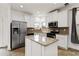 Modern kitchen featuring stainless steel appliances and a granite island at 5885 San Gabriel Ln, Atlanta, GA 30349