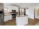 Open concept kitchen with stainless steel appliances and eat-in granite island at 5885 San Gabriel Ln, Atlanta, GA 30349