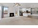 Living room area showcasing modern kitchen, fireplace, and plenty of space at 5885 San Gabriel Ln, Atlanta, GA 30349