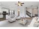 Living room area with modern kitchen, fireplace, and front entry at 5885 San Gabriel Ln, Atlanta, GA 30349