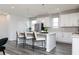 Bright kitchen featuring white cabinets, quartz countertops, a central island, and pendant lighting at 616 Devon Aly, Acworth, GA 30102