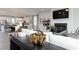 Open-concept living area with fireplace, kitchen, and modern decorations at 616 Devon Aly, Acworth, GA 30102