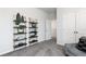 Sitting room features a decorative shelving unit and view to another room at 616 Devon Aly, Acworth, GA 30102
