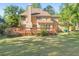 Lush backyard featuring a well-maintained lawn and a spacious deck, perfect for outdoor living at 7389 Tidewater Trce, Stone Mountain, GA 30087