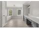 Bright bathroom featuring a bathtub, separate vanities, and tile flooring at 7389 Tidewater Trce, Stone Mountain, GA 30087