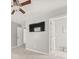 Cozy bedroom with carpet flooring, ceiling fan, and a flat screen TV at 7389 Tidewater Trce, Stone Mountain, GA 30087