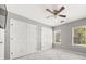 Bedroom with neutral walls, plush carpet, and natural light from a window at 7389 Tidewater Trce, Stone Mountain, GA 30087