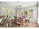 Bright dining room with large windows, modern lighting, and seating for six at 7389 Tidewater Trce, Stone Mountain, GA 30087