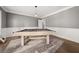 Spacious game room with a pool table, hardwood floors, and neutral paint at 7389 Tidewater Trce, Stone Mountain, GA 30087