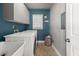 Neat laundry room with a washing machine, dryer, and upper cabinets at 7389 Tidewater Trce, Stone Mountain, GA 30087