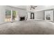 Spacious living room with gray walls, bright windows and a decorative fireplace at 7389 Tidewater Trce, Stone Mountain, GA 30087