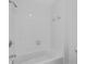 This bathroom has white tile, a tub, and shower at 4065 Tritt Homestead Dr, Marietta, GA 30062