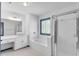 Bright bathroom features a tub and a shower with glass doors at 4065 Tritt Homestead Dr, Marietta, GA 30062