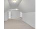 An open bonus room with neutral carpeting, white walls, recessed lighting, and an additional doorway at 4065 Tritt Homestead Dr, Marietta, GA 30062
