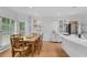 Bright dining room area with large windows and direct access to the kitchen at 4065 Tritt Homestead Dr, Marietta, GA 30062