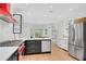 Spacious kitchen with stainless steel appliances, quartz counters, custom cabinets, and large windows at 4065 Tritt Homestead Dr, Marietta, GA 30062