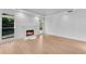 Living room featuring wood floors, a fireplace, and plenty of natural light at 4065 Tritt Homestead Dr, Marietta, GA 30062