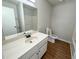 Bathroom featuring a white vanity, toilet, and shower/tub, offering a simple and clean design at 774 Mill Rd, Mcdonough, GA 30253
