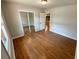 Bright bedroom with hardwood floors, a mirrored closet, and neutral paint, creating a cozy atmosphere at 774 Mill Rd, Mcdonough, GA 30253