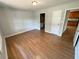 View of a gray bedroom featuring hardwood floors and white trim, creating a bright, updated space at 774 Mill Rd, Mcdonough, GA 30253