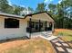Charming home featuring fresh exterior paint, a covered front porch, and professionally landscaped front yard at 774 Mill Rd, Mcdonough, GA 30253