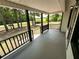 Covered front porch with dark railing, providing a welcoming outdoor space at 774 Mill Rd, Mcdonough, GA 30253