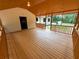 Spacious, enclosed porch for comfortable outdoor enjoyment, with access to the backyard and main house at 774 Mill Rd, Mcdonough, GA 30253
