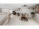 Bright living room with kitchen island, dining area, and a comfortable seating area with stylish decor at 900 Stone Lea Trce, Oxford, GA 30054