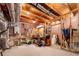 Basement workspace with exposed ducts, water heater, work bench, and pegboard at 1810 Valley Brook Dr, Alpharetta, GA 30005