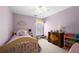 Purple ' bedroom with a twin bed and decorated with fun artwork at 1810 Valley Brook Dr, Alpharetta, GA 30005