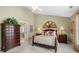Comfortable bedroom with a queen bed, a ceiling fan, and matching bedside tables at 1810 Valley Brook Dr, Alpharetta, GA 30005