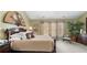 Spacious bedroom with hardwood floors, a large window, and a comfortable king-sized bed at 1810 Valley Brook Dr, Alpharetta, GA 30005