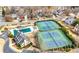 Bird's-eye perspective of community tennis courts, covered swimming pool, clubhouse, and parking area at 1810 Valley Brook Dr, Alpharetta, GA 30005
