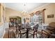 Charming dining area with adjacent living area featuring a large window for natural light at 1810 Valley Brook Dr, Alpharetta, GA 30005