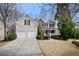 Attractive two-story home with a two-car garage and well-maintained landscaping at 1810 Valley Brook Dr, Alpharetta, GA 30005