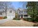 Charming two-story home with stone accents, two-car garage, and landscaped front yard at 1810 Valley Brook Dr, Alpharetta, GA 30005