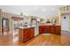 Well-lit open kitchen with a breakfast bar, white appliances, and a breakfast nook at 1810 Valley Brook Dr, Alpharetta, GA 30005