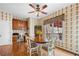 Bright kitchen nook featuring a window with backyard view and a stylish wallpaper at 1810 Valley Brook Dr, Alpharetta, GA 30005