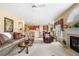 Open-concept living room with a fireplace and seamlessly connected to the breakfast nook and kitchen at 1810 Valley Brook Dr, Alpharetta, GA 30005