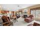 Spacious living room featuring a cozy fireplace, abundant natural light, and inviting seating at 1810 Valley Brook Dr, Alpharetta, GA 30005
